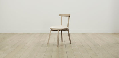 The Allen  - Pebbled Leather Swan Dining Chair